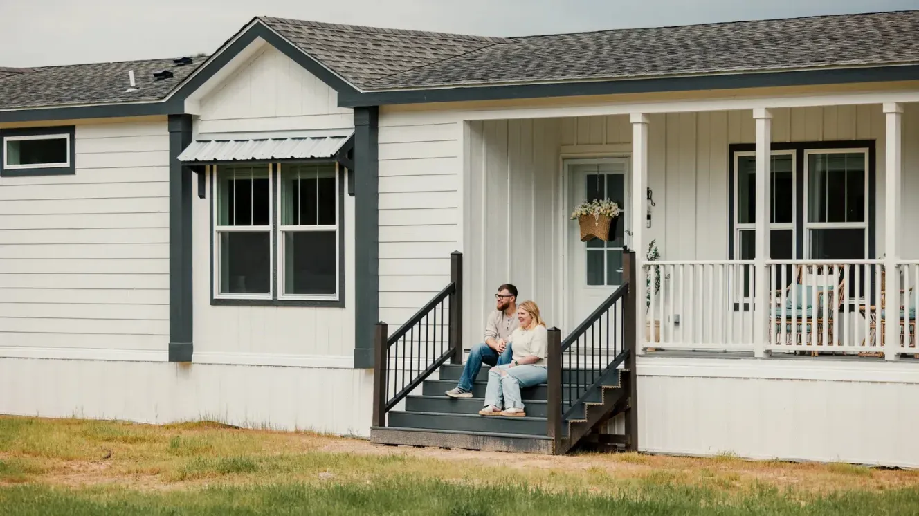 Manufactured home with a front porch on rural property